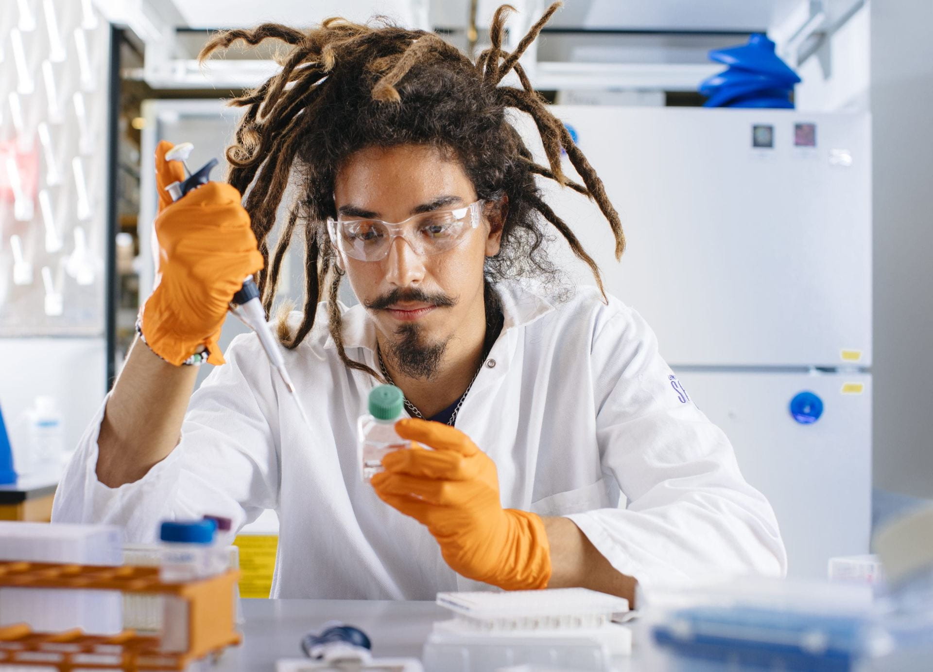 Male scientist doing experiment in lab